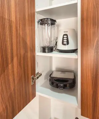 a blender and a toaster on a shelf in a kitchen at residence living housse in Casablanca