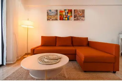 a living room with a couch and a table at residence living housse in Casablanca