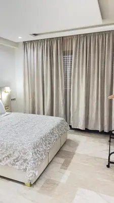 a bedroom with a bed and a large window at Casablanca Center Studio Karachi 33 in Casablanca