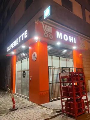 a store front with an orange door in front of it at La garonne in Casablanca