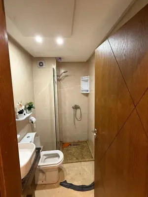 a bathroom with a toilet and a sink and a shower at La garonne in Casablanca