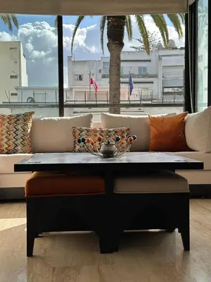 a coffee table in a living room with a couch at 9 Rue d'Alger Casablanca in Casablanca