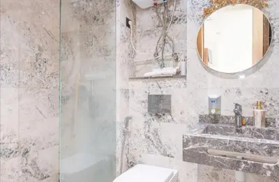 a bathroom with a shower and a sink and a mirror at Super Summit Apartments Le Phenix in Casablanca