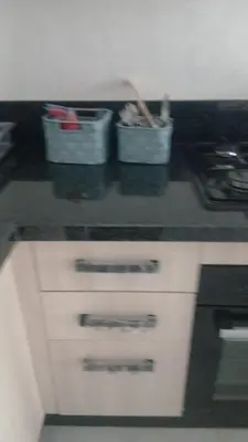 two buckets on a counter in a kitchen at Relaxing Studio Stay with Pool, Balcony & Smart TV in Aïn Harrouda