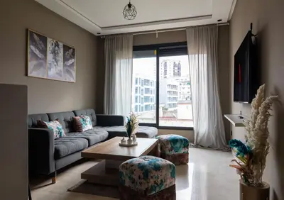 a living room with a couch and a table at Studio Joudia in Casablanca