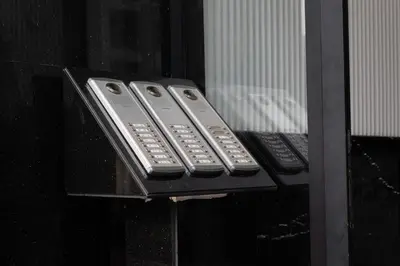 three remote controls are sitting on a table at Studio Joudia in Casablanca