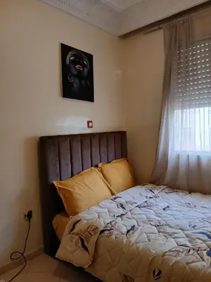 a bed in a room with a window and a bed sidx sidx sidx at Cambre à louer in Casablanca