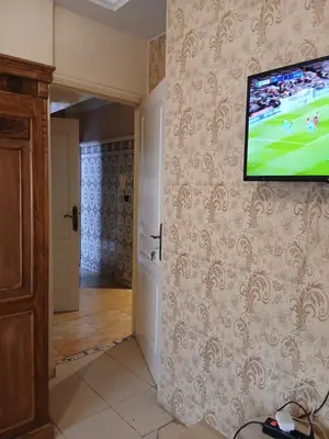 a flat screen tv hanging on a wall in a room at Cambre à louer in Casablanca