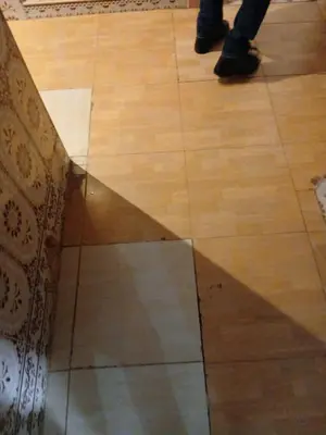 a reflection of a person on a wooden floor at Cambre à louer in Casablanca