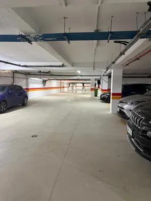 a parking garage with cars parked in it at Appartement de luxe in Casablanca