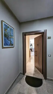 a hallway with a door and a painting on the wall at Beachfront View Appartement in Mohammedia