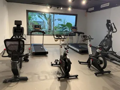 a gym with several exercise bikes in a room at Charming 1-bedroom apartment, Casablanca Finance City in Casablanca