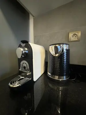 a coffee maker sitting on top of a counter at Agdal Gare View Apartment in Rabat