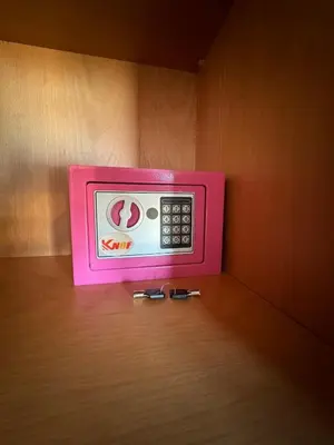 a pink microwave sitting on top of a table at Agdal Gare View Apartment in Rabat