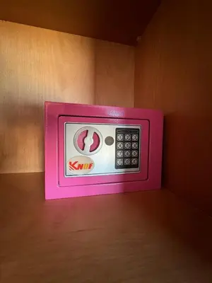 a pink microwave sitting on top of a table at Agdal Gare View Apartment in Rabat