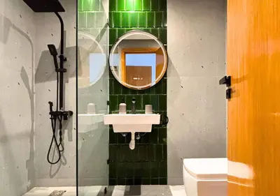 a bathroom with a sink and a mirror at Grand Studio Moderne au Centre, Parking Privé in Casablanca
