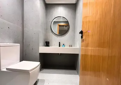 a bathroom with a white toilet and a mirror at Grand Studio Moderne au Centre, Parking Privé in Casablanca