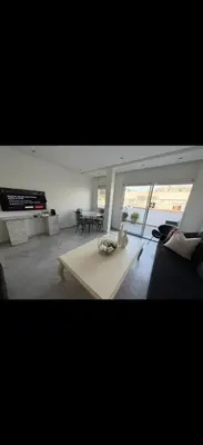 a living room with a couch and a coffee table at Chez baya in Rabat