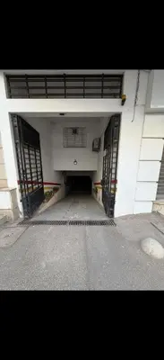 an empty hallway of a building with doors open at Chez baya in Rabat