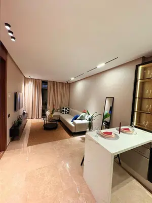 a living room with a couch and a table at stylish studio located in centre of casablanca in Casablanca