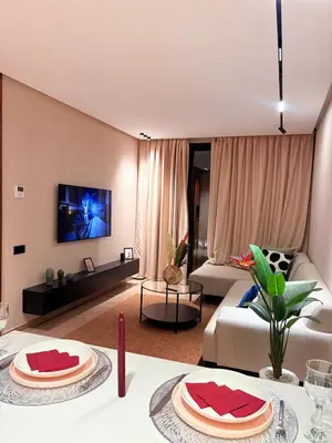 a living room with a couch and a table at stylish studio located in centre of casablanca in Casablanca