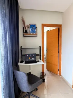 a room with a desk with a laptop computer on it at Modern Chic Studio avec Terrace privée et Vue Sans Vis-a-vis et Parking privé in Casablanca