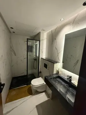 a bathroom with a toilet and a sink and a shower at Calme et Comfort ,cozy, centre de Casablanca in Casablanca
