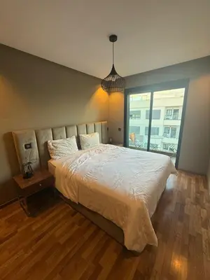 a bedroom with a large bed and a large window at Calme et Comfort ,cozy, centre de Casablanca in Casablanca