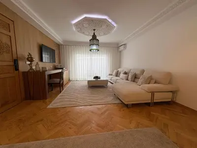 a living room with a couch and a table at Palais Elya in Rabat