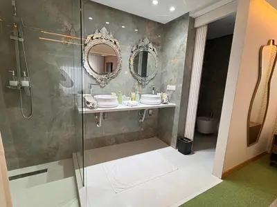 a bathroom with a shower and a sink at Palais Elya in Rabat