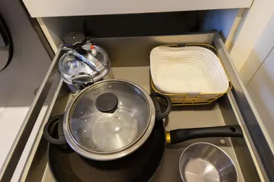 a pot and pans sitting on a stove in a drawer at Modern CFC Flat with Terrace Gym & City Views in Casablanca
