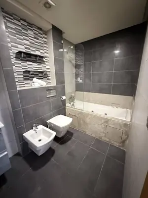 a bathroom with a sink and a toilet and a tub at Appartement Haut Standing in Casablanca