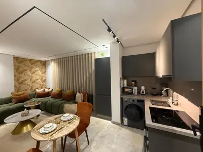a living room with a couch and a table at Luxury Studio Casa Center in Casablanca