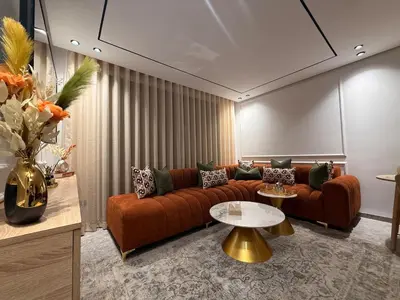 a living room with a couch and a table at Apparently city center in Casablanca