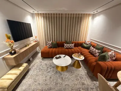 a living room with a couch and a table at Apparently city center in Casablanca