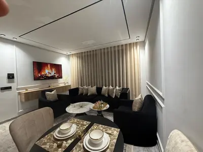 a living room with a couch and a table at Jolie studio plein centre Casablanca in Casablanca