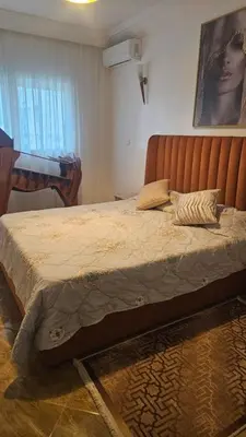a large bed in a room with a piano at Stunning 2 bedrooms flat Palmier in Casablanca