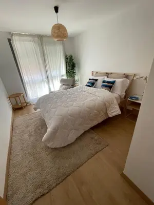 a bedroom with a large bed with a rug at Private Room,Piscine & Parking en cohabitation avec le hôte seulement à 6 min Airport MohamedV in Nouaceur