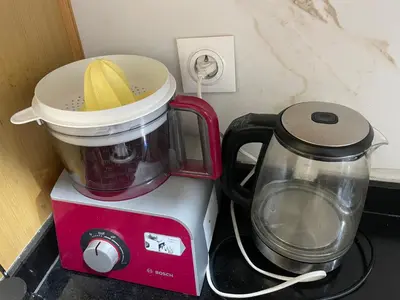 a blender sitting on top of a counter next to a mixer at Private Room,Piscine & Parking en cohabitation avec le hôte seulement à 6 min Airport MohamedV in Nouaceur
