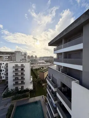 an overhead view of an apartment building with a pool at Luxury 1BR CFC with Pool, Balcony & City View in Casablanca