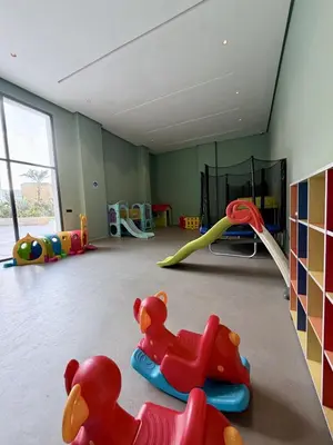 a room with a play room with toys in it at Luxury 1BR CFC with Pool, Balcony & City View in Casablanca