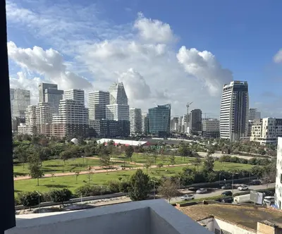 a view of a city skyline with tall buildings at Bridge Collection - Mirage in Casablanca