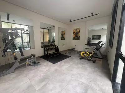 a gym with treadmills and machines in a room at Bridge Collection - Mirage in Casablanca