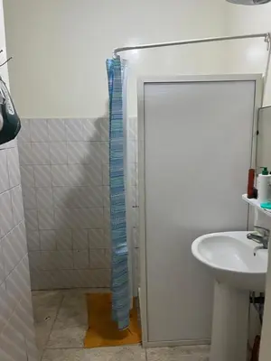 a bathroom with a shower and a sink at Agdal Rabat superb furnished modern studio with large terrace in Rabat