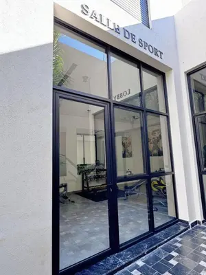 a store front with large glass windows on a building at anfa park residence beau living park in Casablanca