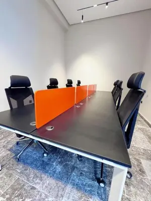 a conference room with a long table and chairs at anfa park residence beau living park in Casablanca