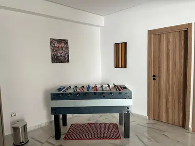 a room with a foosball table in the corner at Cosy Appart au Parc Mohammédia in Mohammedia