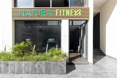 a store front with a sign that reads kennaeus at Piscine Chauffée Salle de Sport Balcon Panoramique in Mohammedia