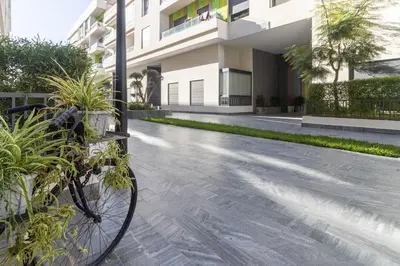 a bike parked in front of a building at Piscine Chauffée Salle de Sport Balcon Panoramique in Mohammedia