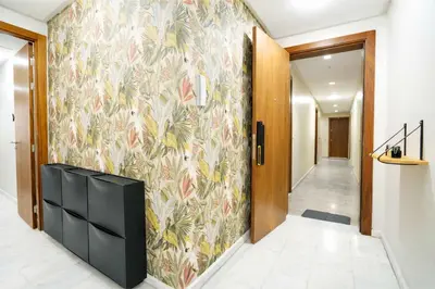 a hallway with a wall mural of flowers at Studio Paisible aux Hopitaux Wifi & Parking in Casablanca